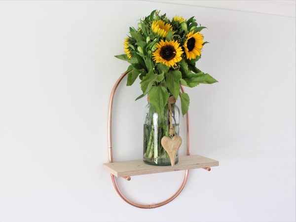 Vase if Sunflowers on a Copper Plant Shelf